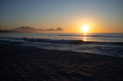 Scenic view of sea against sky during sunset