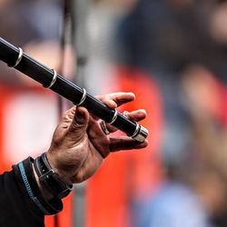Cropped image of person playing flute
