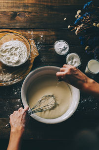 High angle view of woman preparing food on table