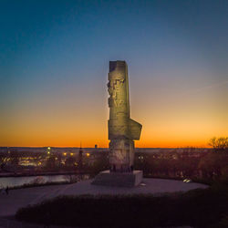 Traditional building against clear sky during sunset