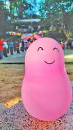 Close-up of pink balloons against trees