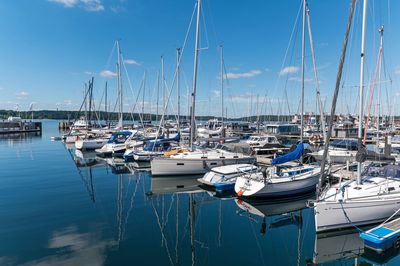 Boats moored at harbor