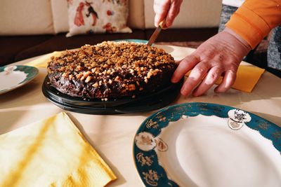 High angle view of person preparing food on table