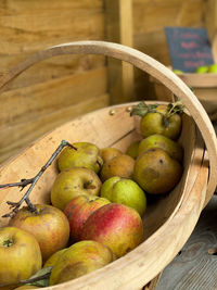 High angle view of apples in basket on table