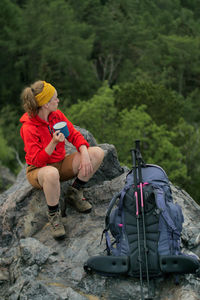 People sitting on land against mountain