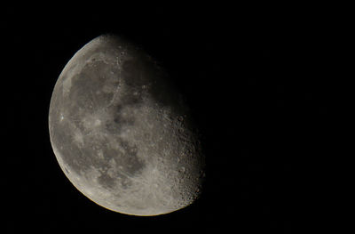 Low angle view of moon against clear sky at night