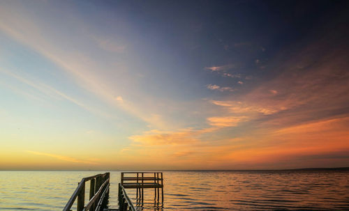 Scenic view of sea against sky at sunset