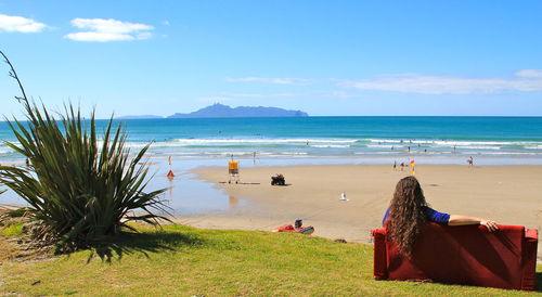 Scenic view of beach against blue sky