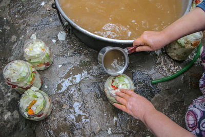 High angle view of person preparing food in water