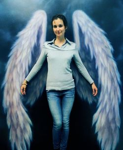 Portrait of beautiful young woman standing outdoors