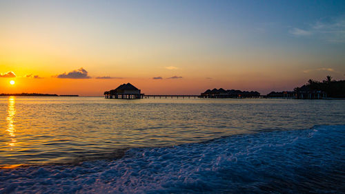 Scenic view of sea against sky at sunset