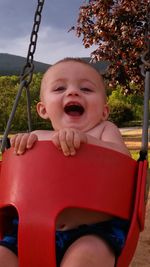 Portrait of girl sitting in playground