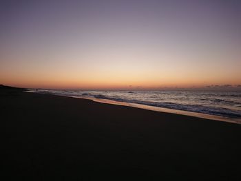 View of beach at sunset