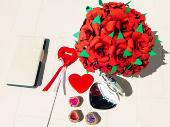 High angle view of red roses on table