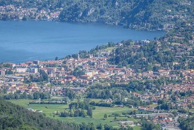 High angle view of townscape by sea