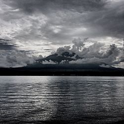 Scenic view of sea against cloudy sky