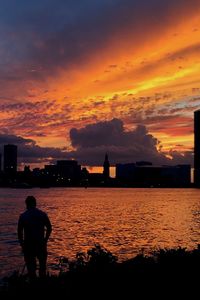 Silhouette of city at sunset