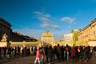 Group of people in front of historical building