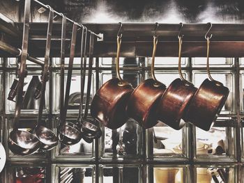 Sauce pans hanging in commercial kitchen