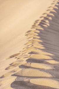 High angle view of shadow on sand