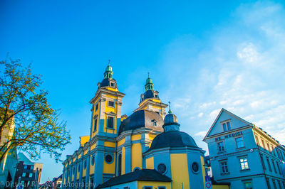 Low angle view of building against blue sky