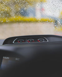 Close-up of raindrops on car windshield