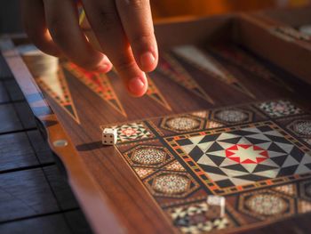 Midsection of person holding table