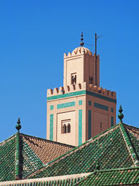 Low angle view of building against clear blue sky