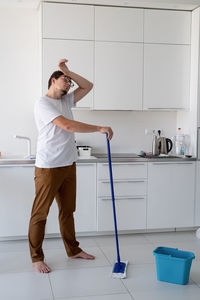 Full length of man standing at home