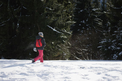 Woman on snow covered field