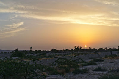 Scenic view of silhouette landscape against sky during sunset