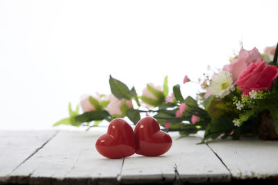 Close-up of red rose on table