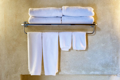 Close-up of clothes drying on white wall