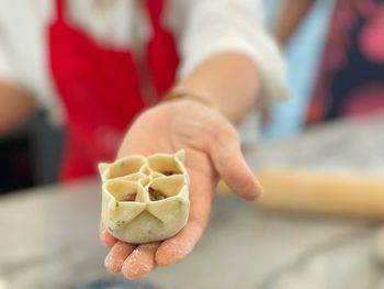 Close-up of hand holding ice cream