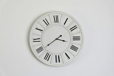 Close-up of clock on wall