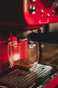 Close-up of coffee pouring in glass