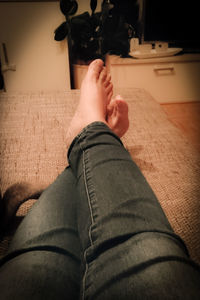 Low section of man sitting at home