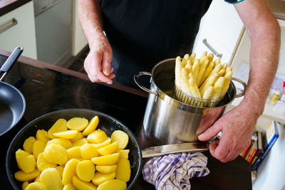 Midsection of man preparing food