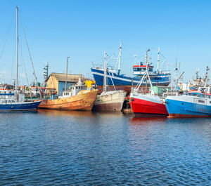 Cutter ships and sailboat standing in the harbour in darlowko, 