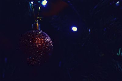 Close-up of illuminated christmas tree at night