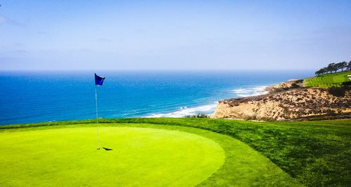 View of golf course at coast