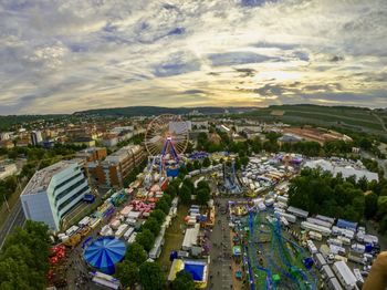 Aerial view of townscape against cloudy sky