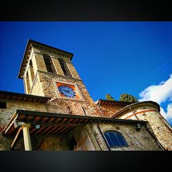 Low angle view of church against blue sky