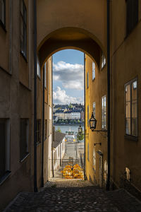 Street amidst buildings in city against sky