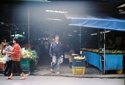 People at market stall