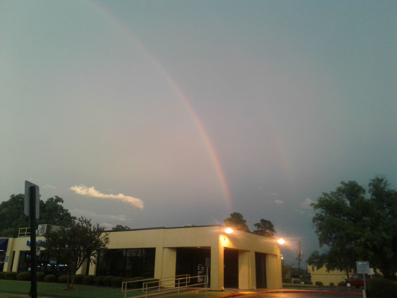 LOW ANGLE VIEW OF RAINBOW OVER BUILDINGS