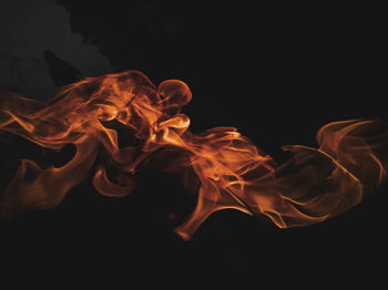 Close-up of bonfire against black background