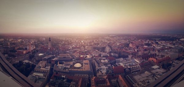 Fish-eye lens on cityscape against clear sky