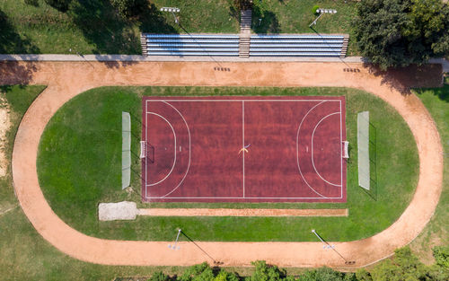 High angle view of empty benches on field