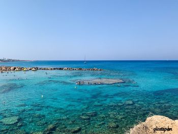 Scenic view of sea against clear sky